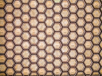 Close-up of a beautifully designed hexagonal pattern inspired by Islamic geometry in deep emerald green and luxury gold.