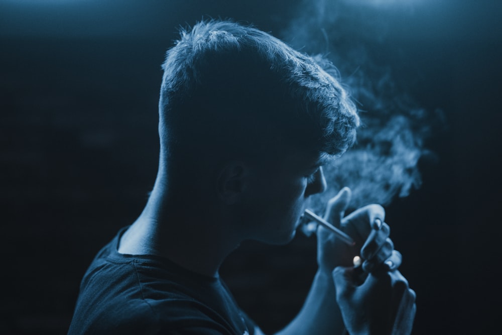 man standing and smoking