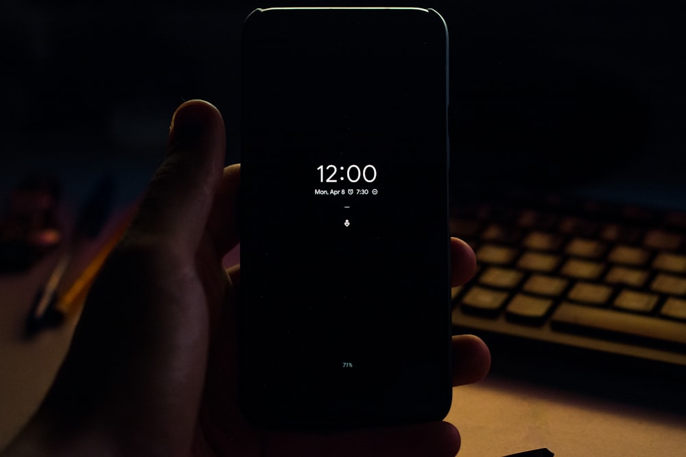 smartphone displaying 12:00 time