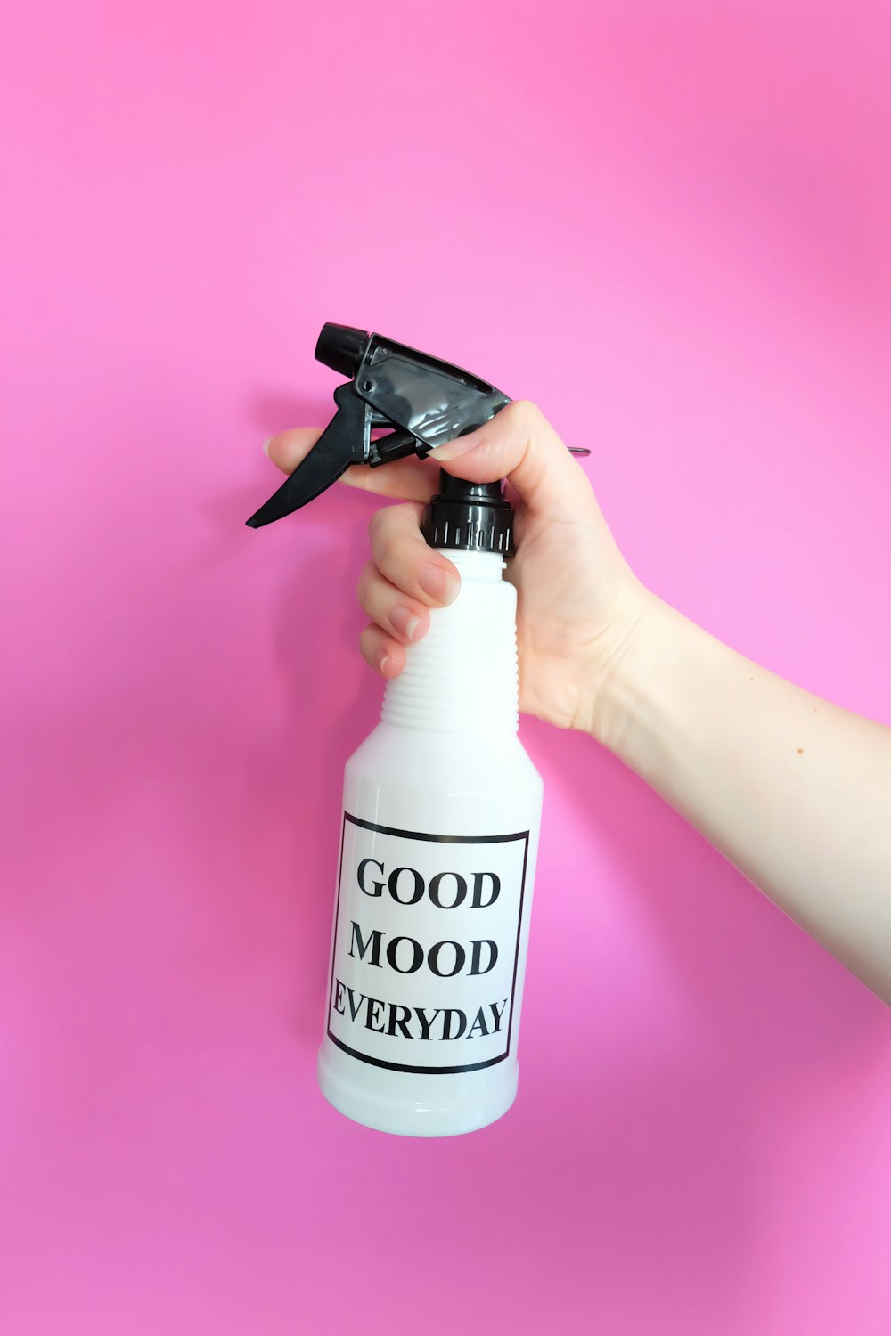 white and black spray bottle