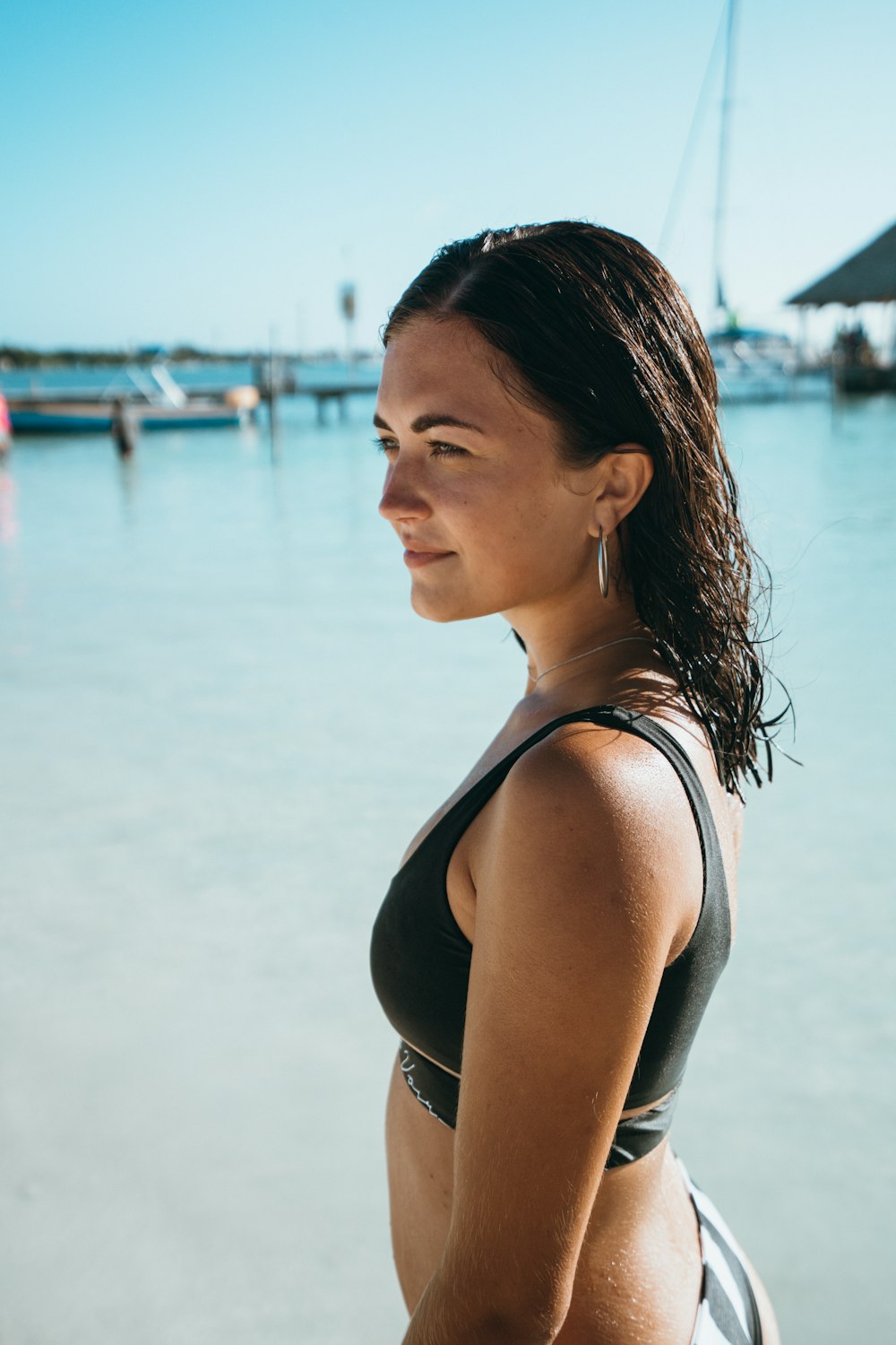 woman wearing bikini bra near dock