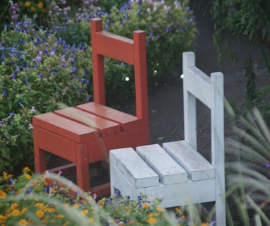 two red and white wooden armless chairs