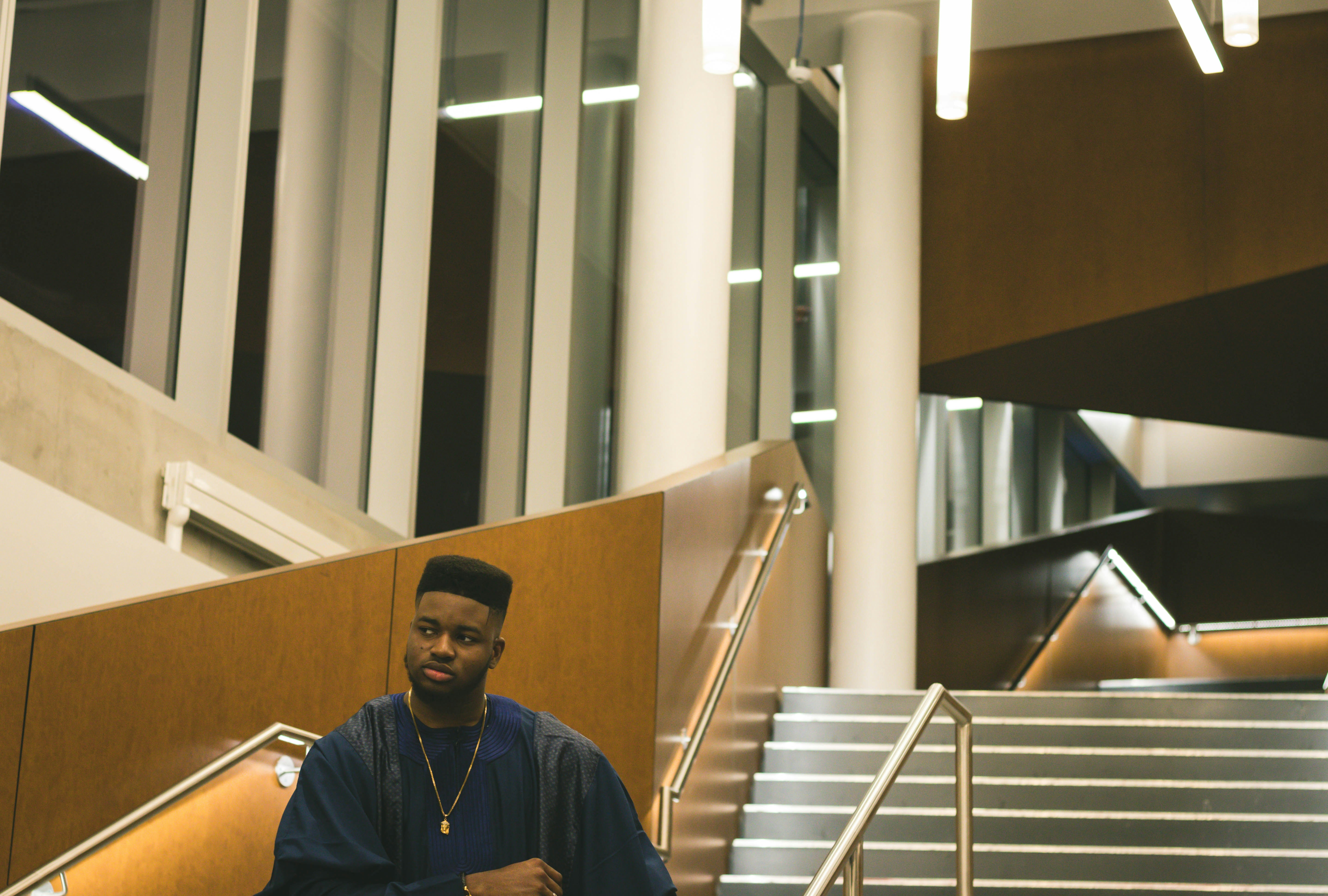 man on stairs inside building