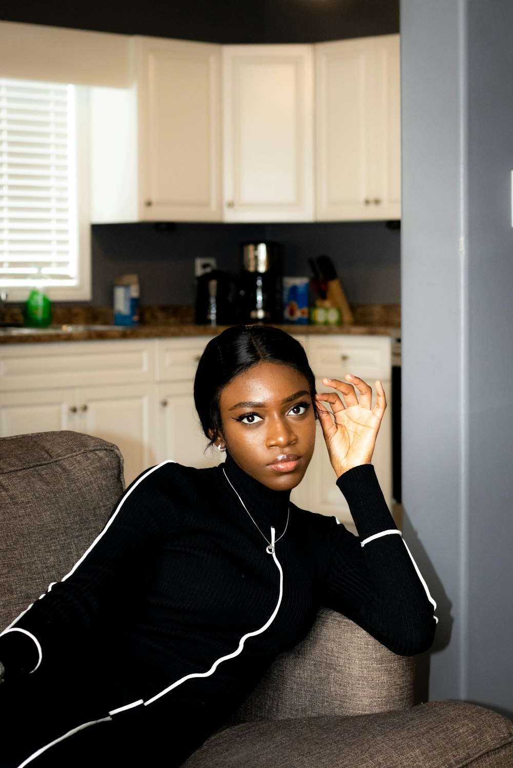 woman laying on sofa