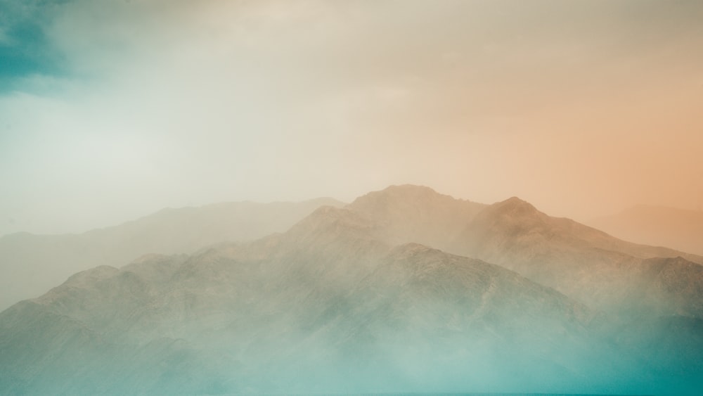 mountain with fog at daytime