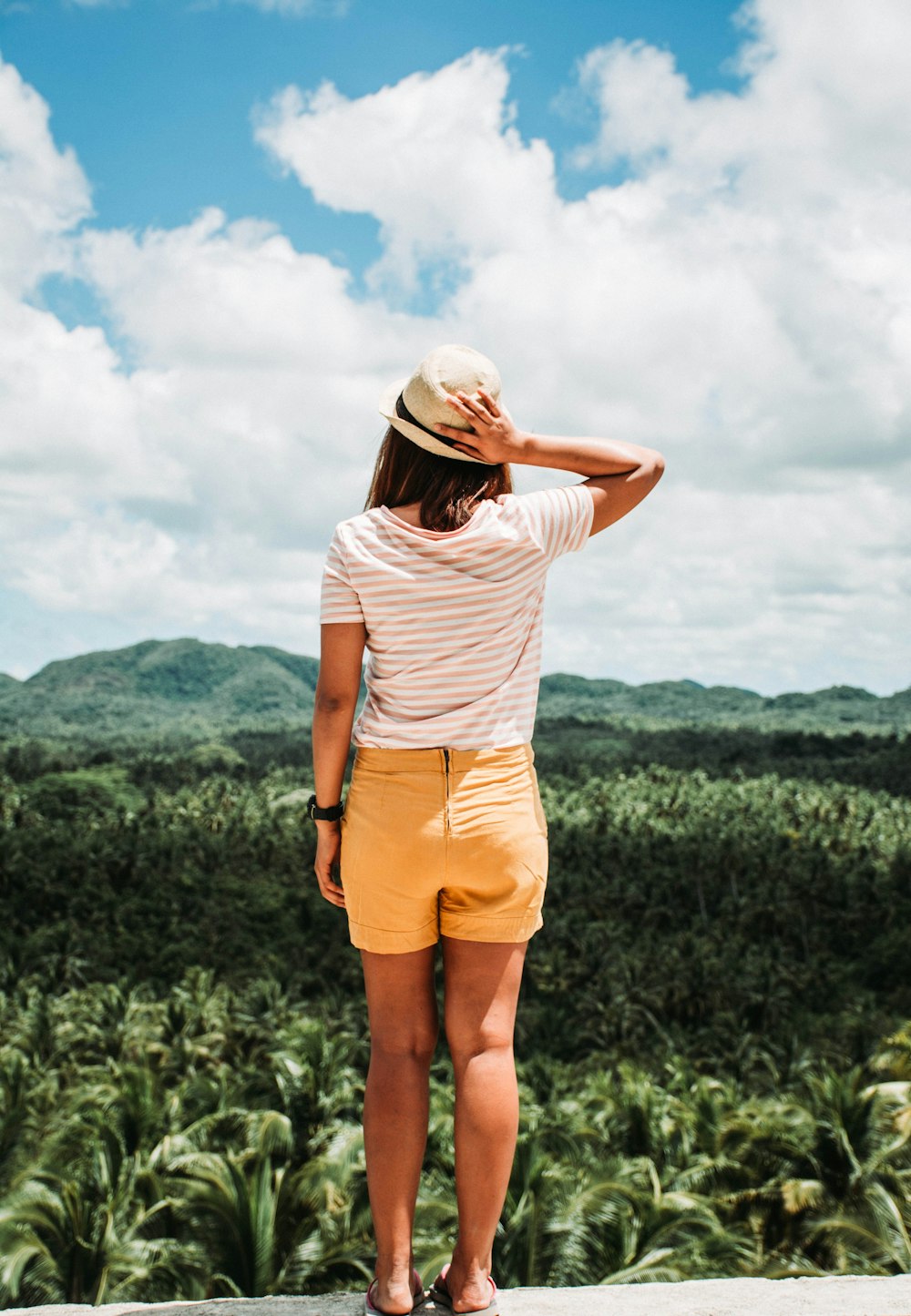 woman wearing yellow shorts