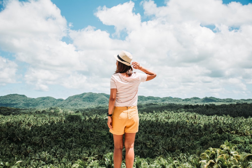 woman standing near trees