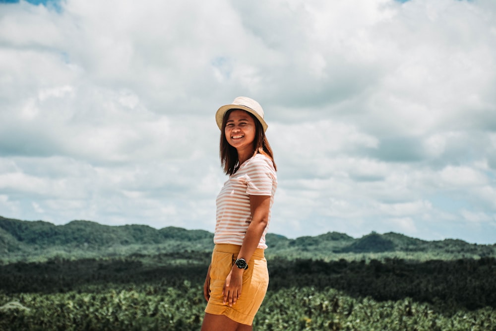 woman wearing white crew-neck shirt and yellow short