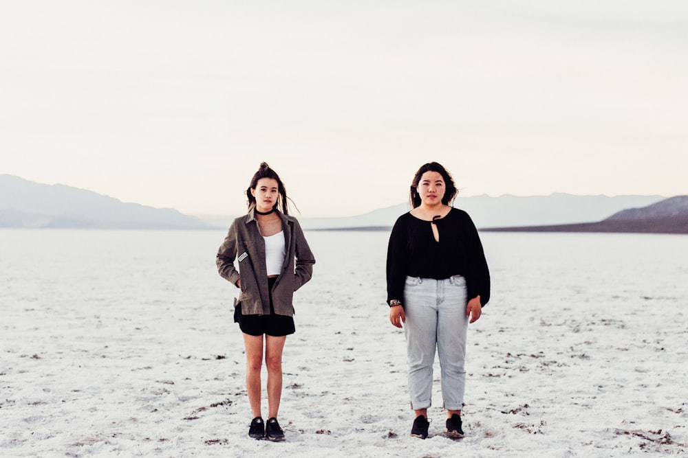 two women standing on surface