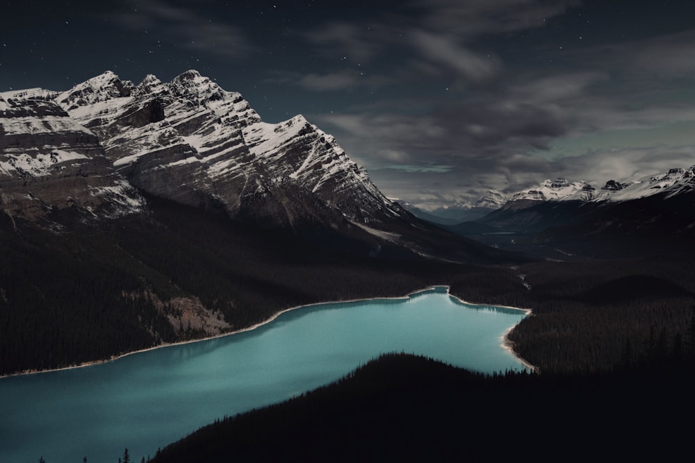 mountain alps surrounding body of water