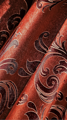 Seasonal collection fabrics with rich copper and burgundy highlights displayed.
