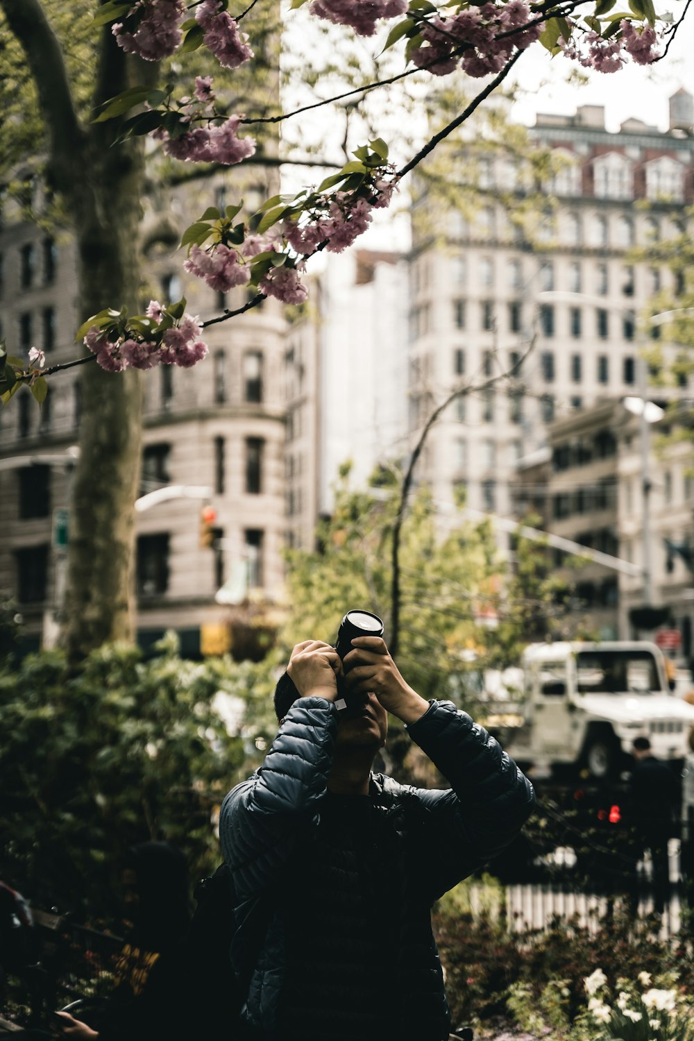 men holding a camera during daytime