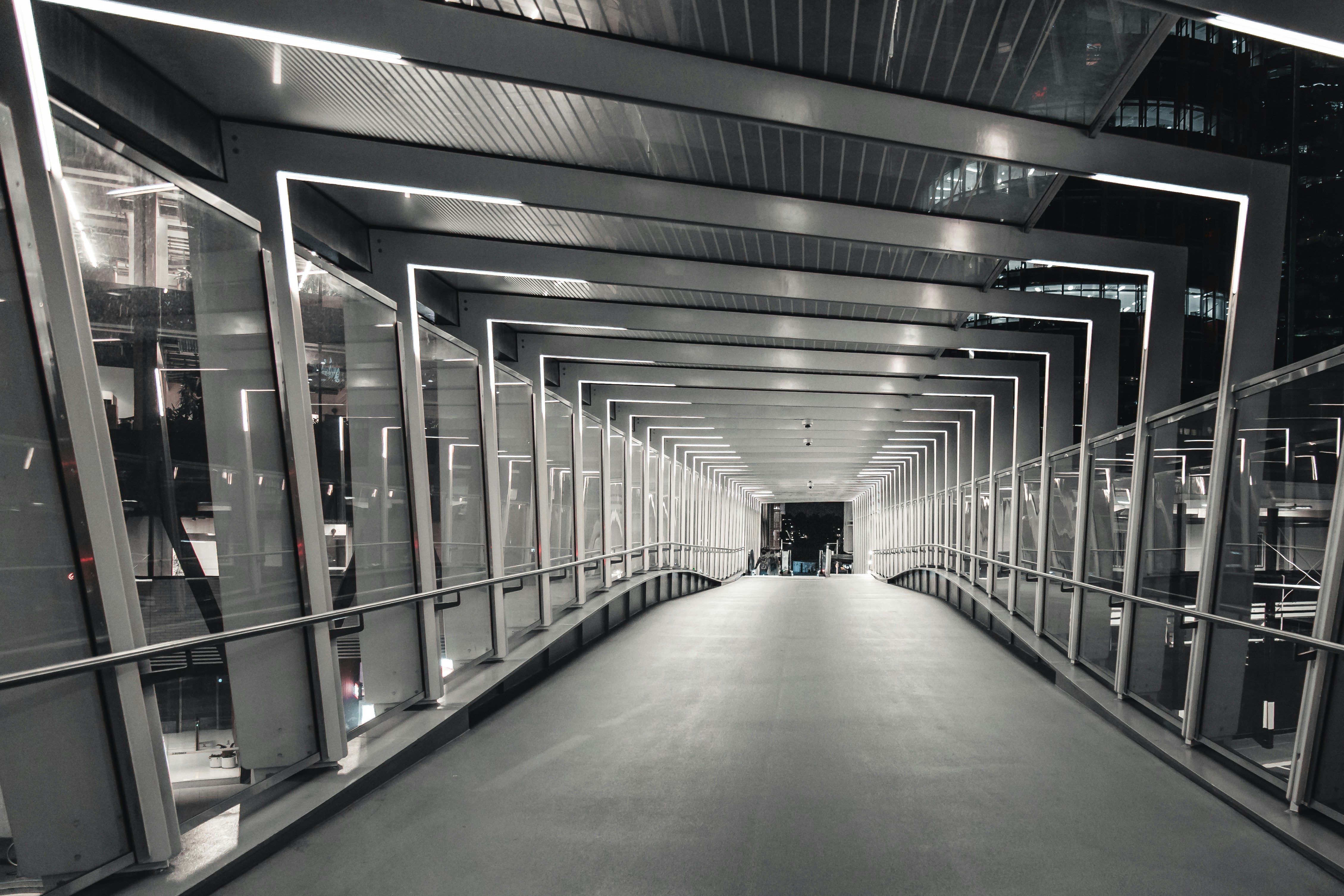 greyscale photography of metal building