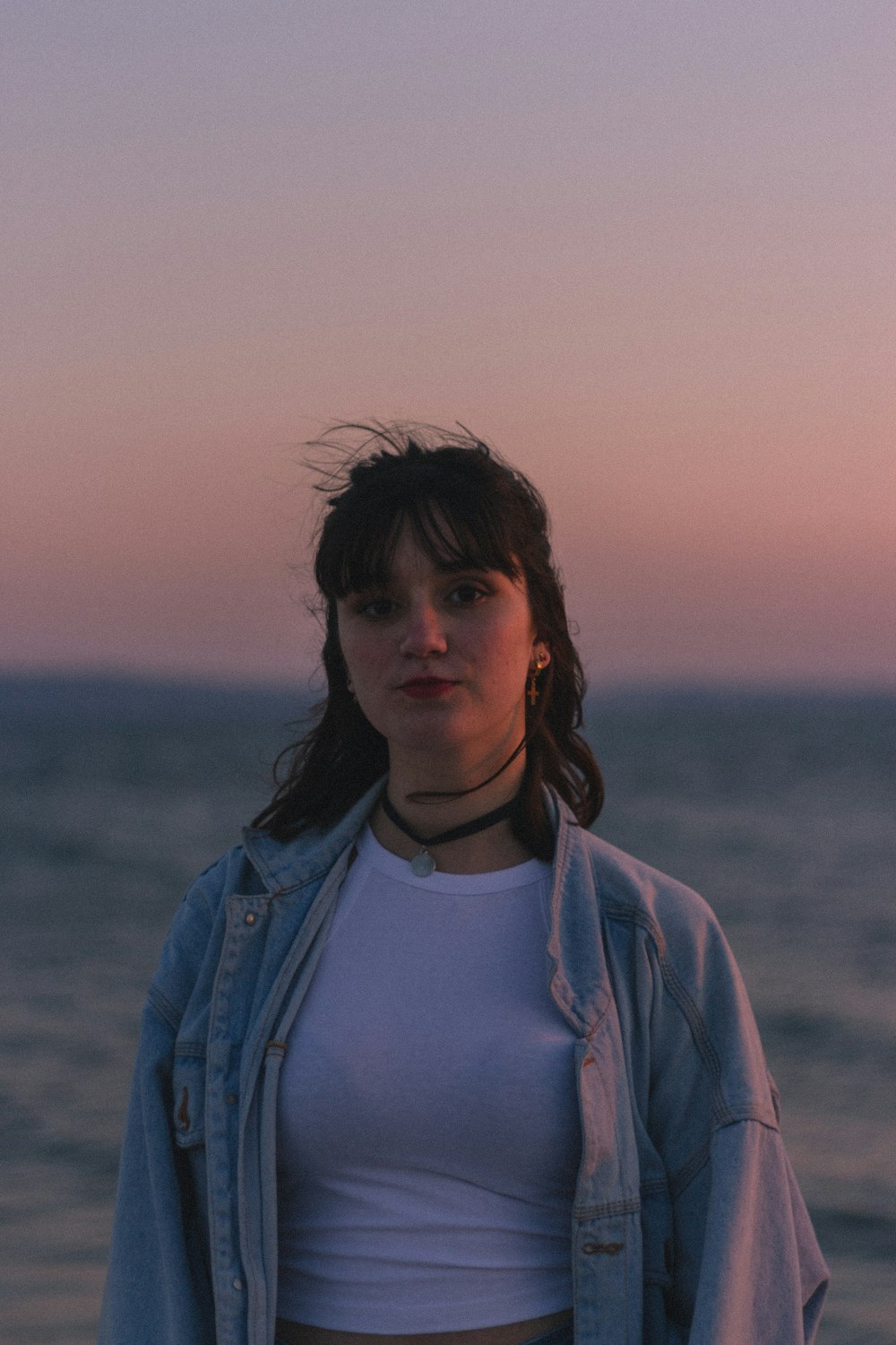 women's white crew-neck shirt and blue denim jeans