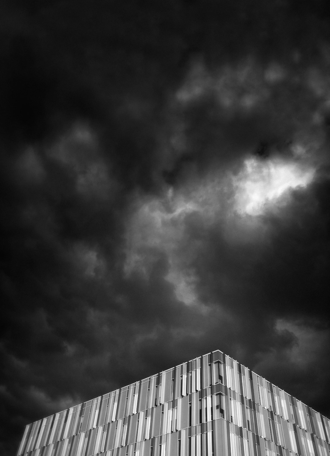 building under black cloud