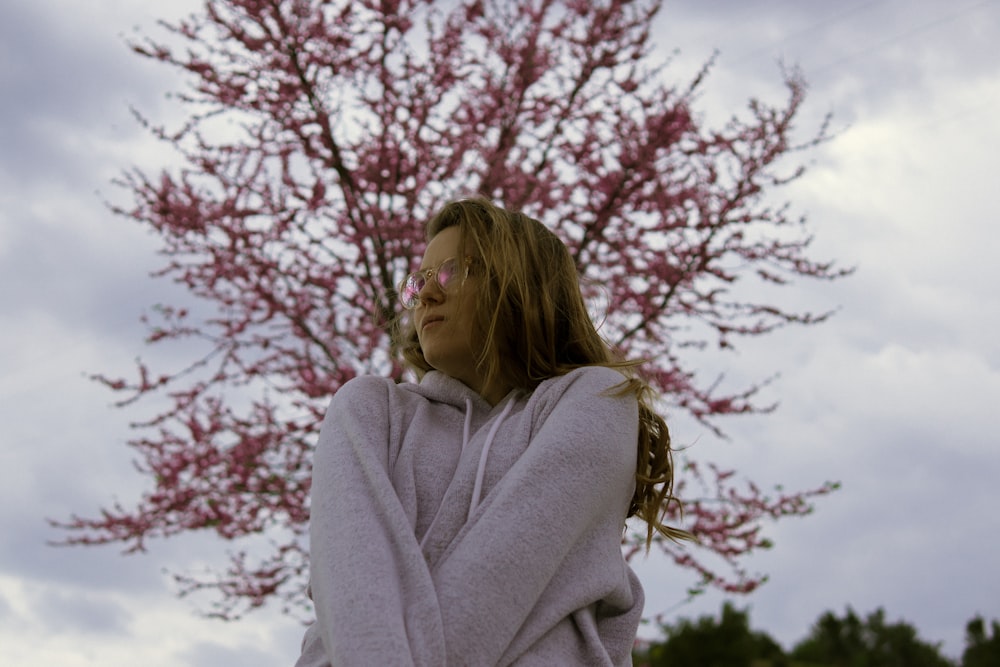 woman standing near tree