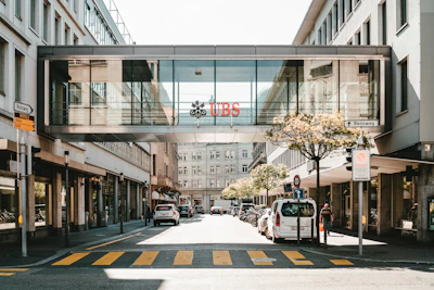 UBS logo on glass bridge wall during daytime