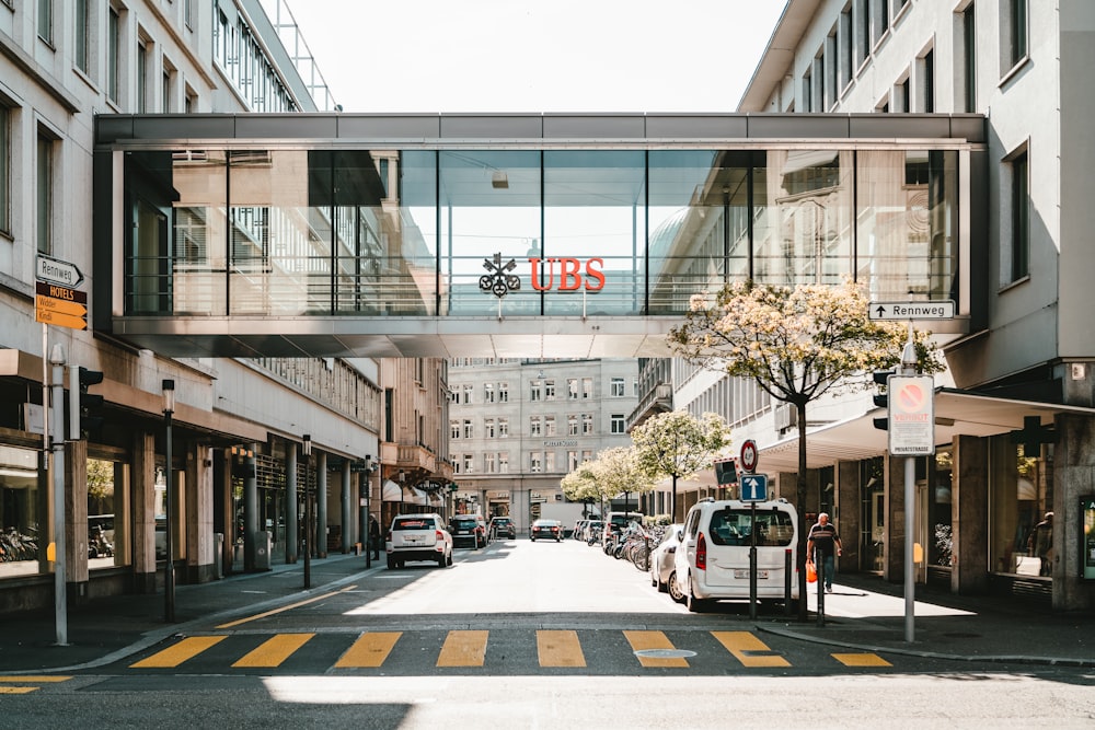 UBS logo on glass bridge wall during daytime