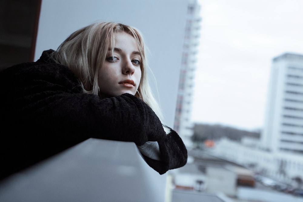 woman leaning on railing