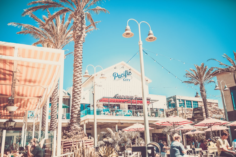 photography of people sitting near patio area during daytime