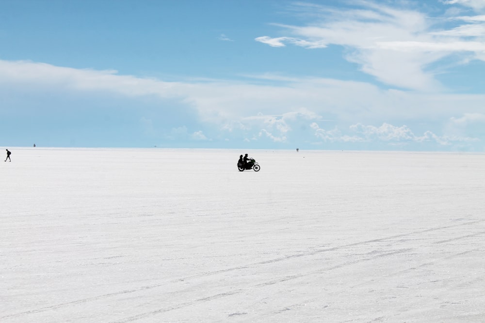 group of people standing on snow