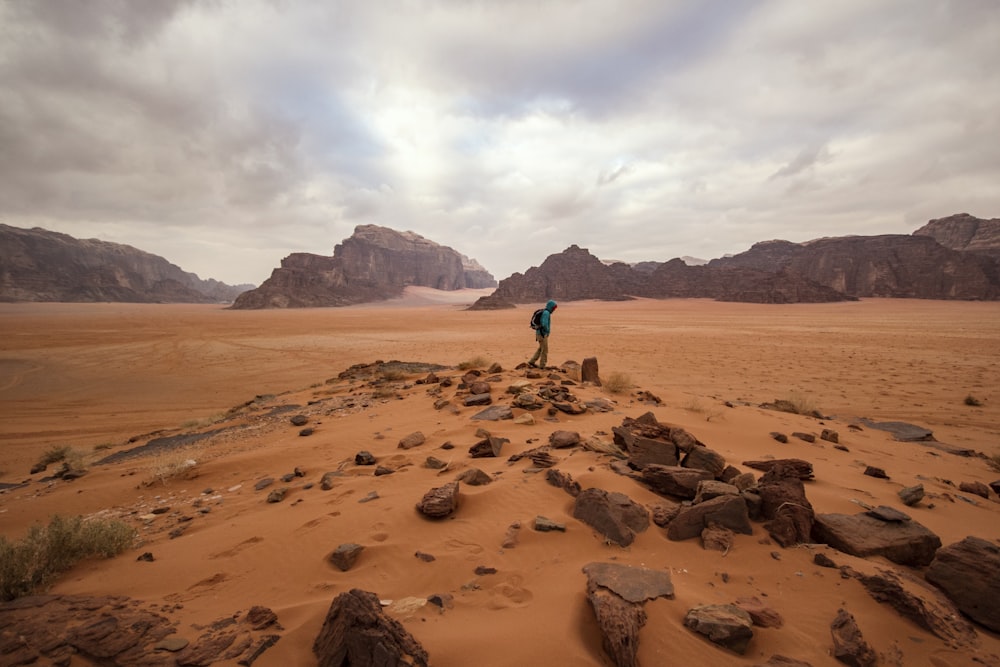 person near rock formation during daytime