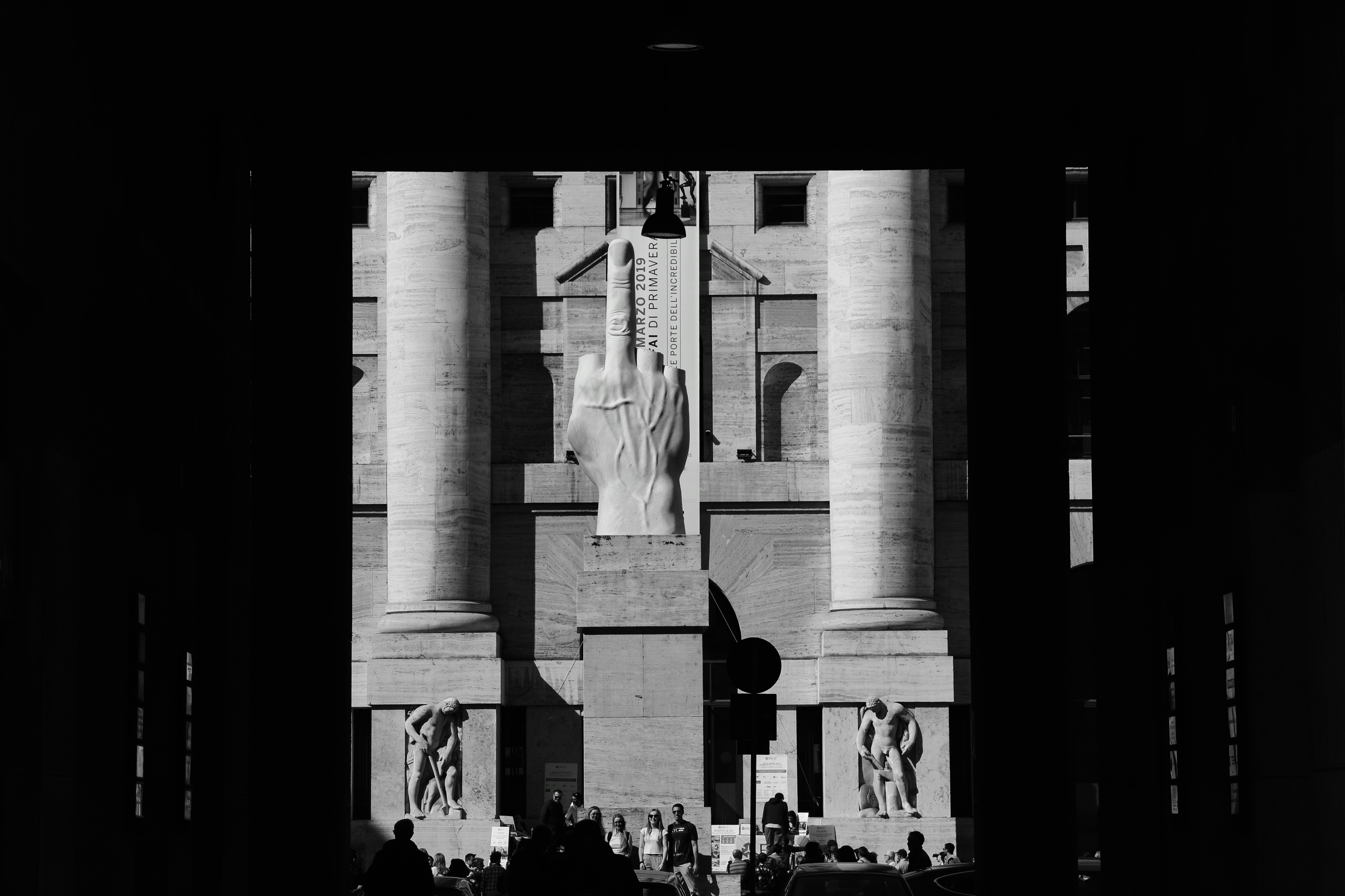 During FAI open days it is possible to visit privatly owned heritage such as Palazzo Mezzanotte in Piazza Affari at Milan. In front of Borsa Italiana it is placed a Maurizio Cattelan statue L.O.V.E.