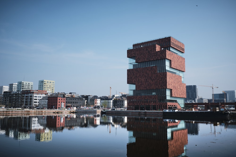 concrete buildings near body of water