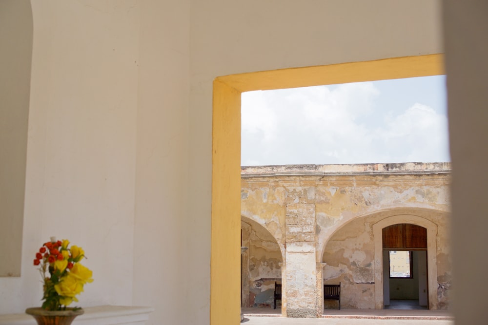 panoramic photography of grey concrete building through doorway