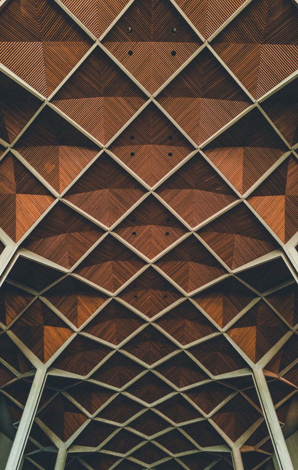 a wooden ceiling with a geometric pattern on it