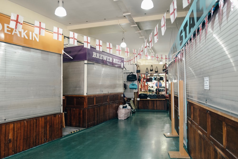 a store with a green floor and a sign on the wall