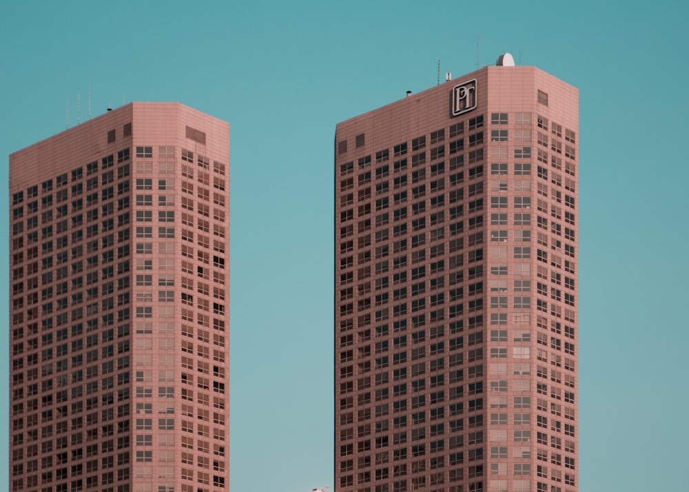 two brown towers during daytime