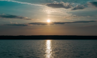 A serene image depicting a peaceful sunset, symbolizing the journey of the soul.
