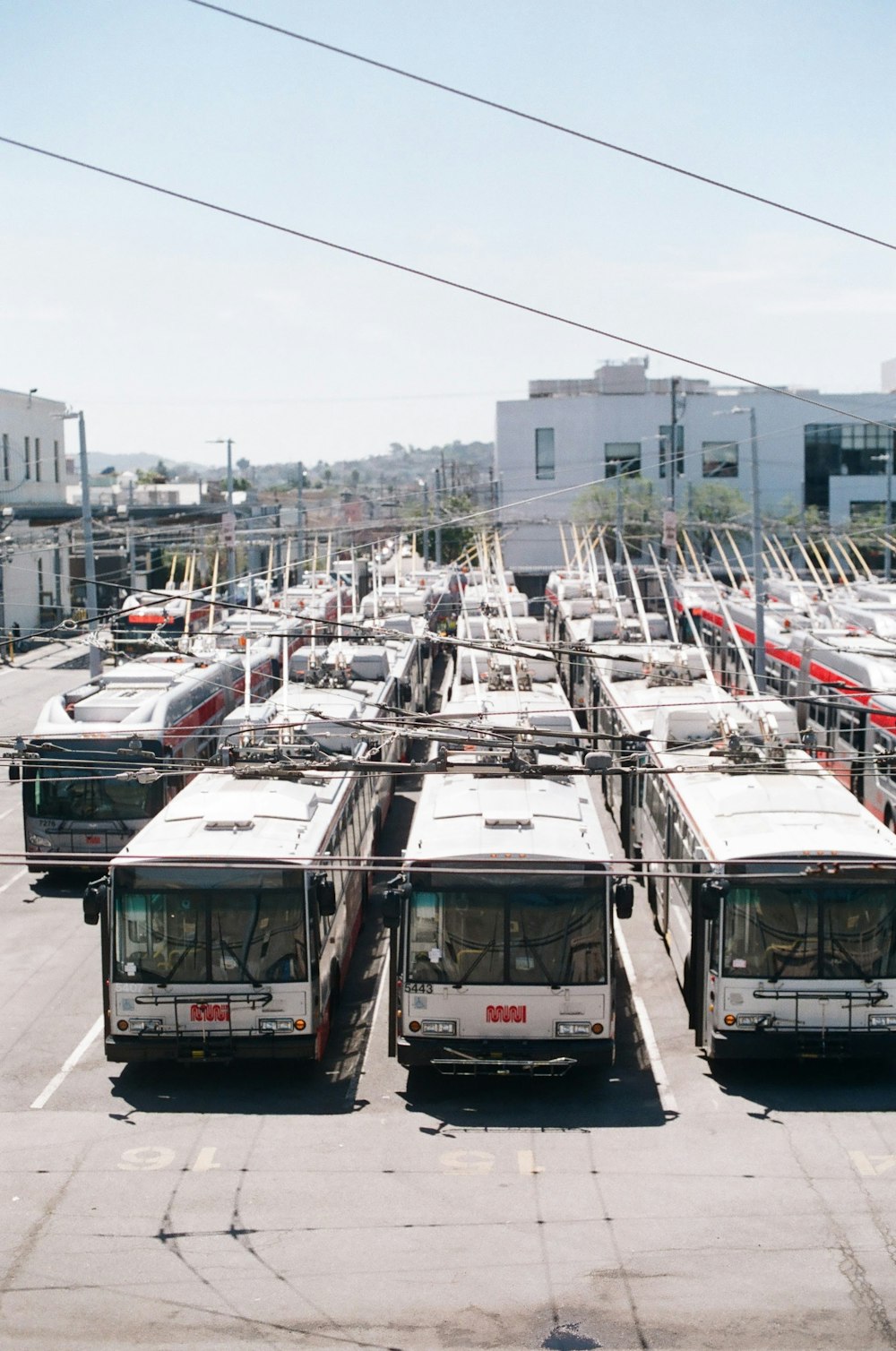 bus parked under white clouds