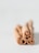 Four cinnamon sticks are arranged in a bundle, showcasing their curled ends. The image has a soft focus background, emphasizing the cinnamon’s texture.