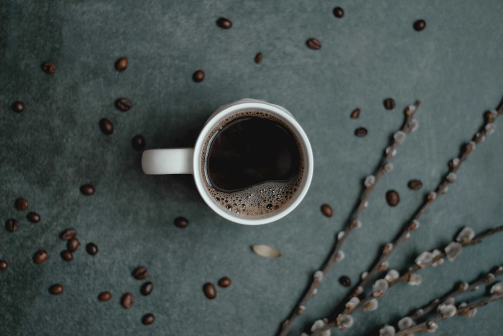 white ceramic cup with coffee close-up photography