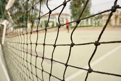 Close-up of sturdy volleyball netting tightly secured on a terrace.