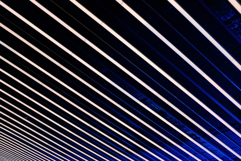 a train traveling down a train track under a blue sky