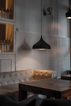 A cozy, well-lit finished basement with comfortable seating and stylish decor.