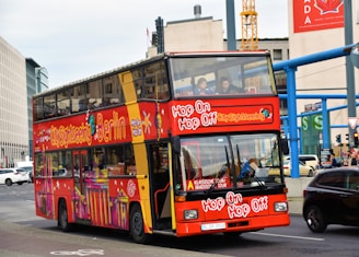 red double deck bus during daytime