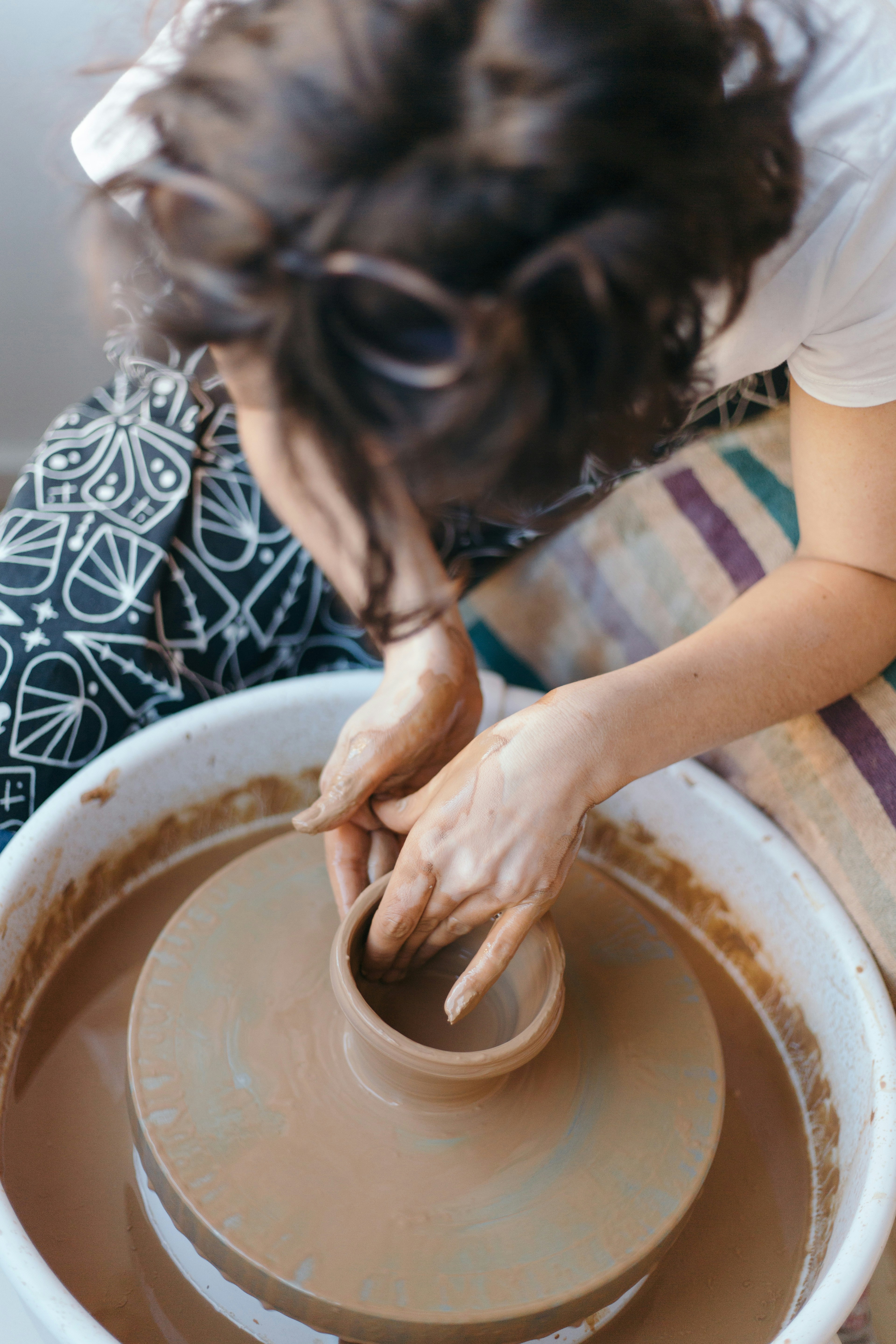 woman making pottery