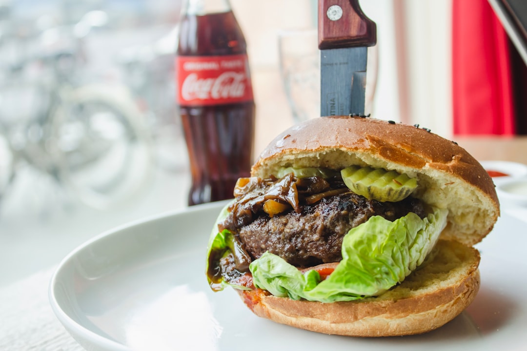 burger near Coca-Cola bottle