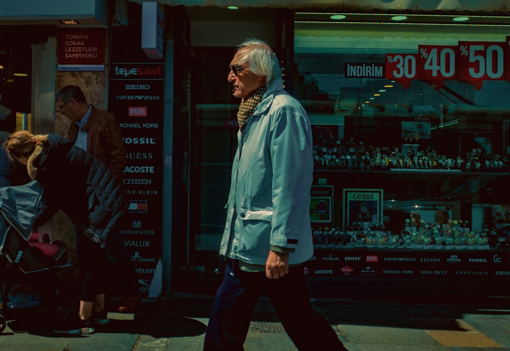 man wearing teal zip-up jacket