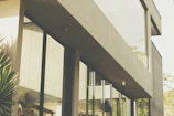 Contemporary exterior view of a compact, functional architectural model with greenery.