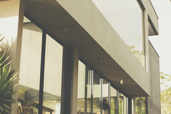 Contemporary exterior view of a compact, functional architectural model with greenery.