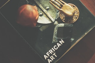 Close-up of handcrafted African art pieces on display.