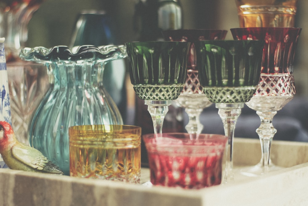 shallow focus photo of green footed glass cups