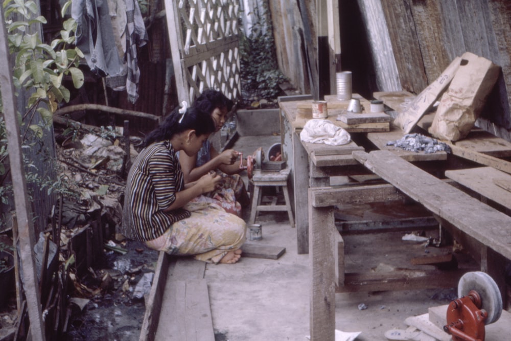 two women sitting on floor