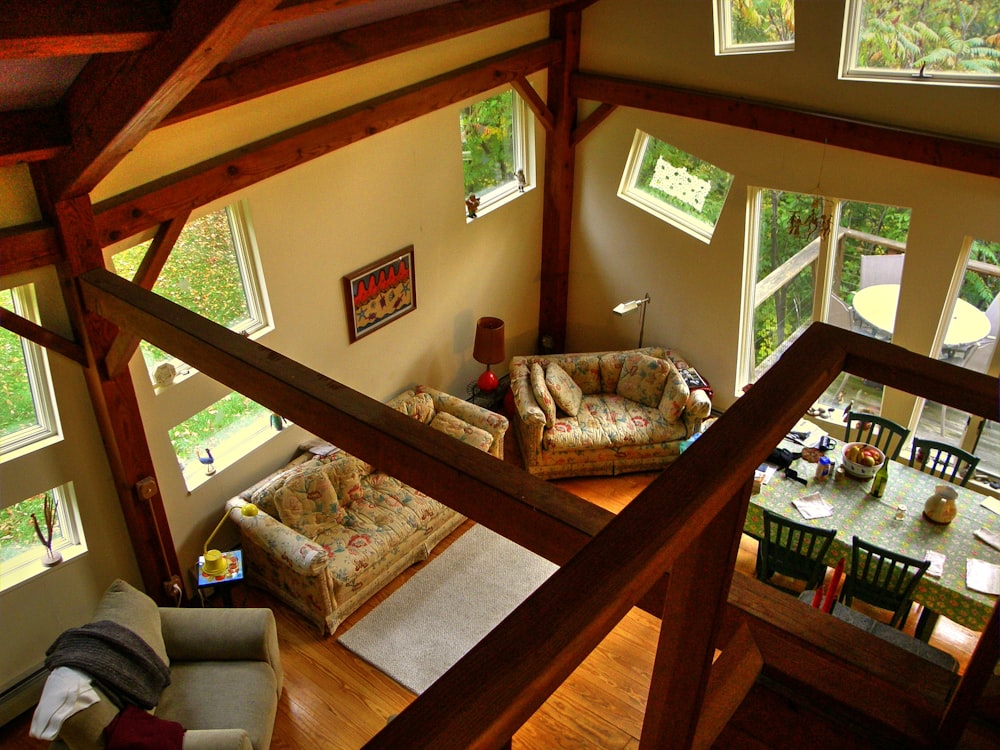 brown padded loveseat near balcony