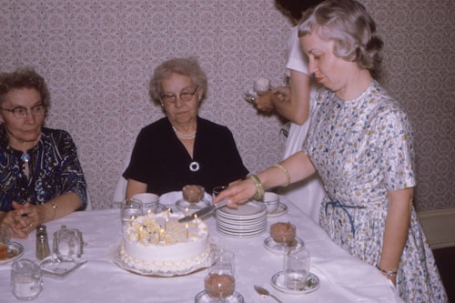 Grandmothers at a birthday tea party, 1960s